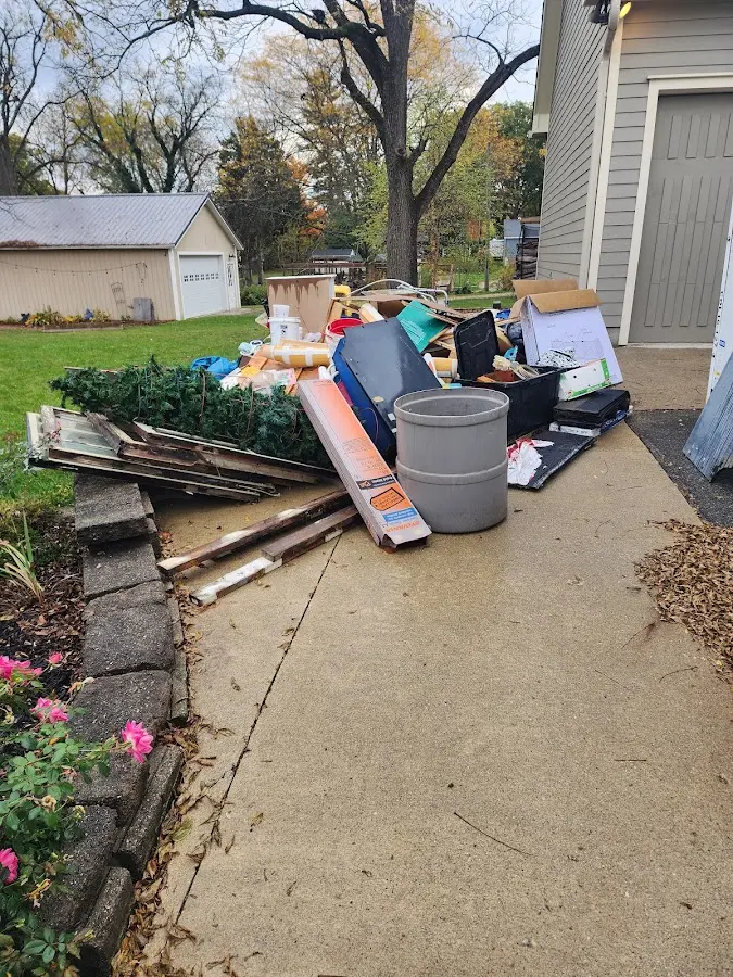 Dumpster being loaded with debris for 12 Yard Dumpster Rental in West Hazleton